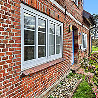 Amrumer Liebhaberstück in Bestlage Norddorf: Freistehendes Friesenhaus mit Charme, Kamin, Meerblick & historischem Kachelzimmer